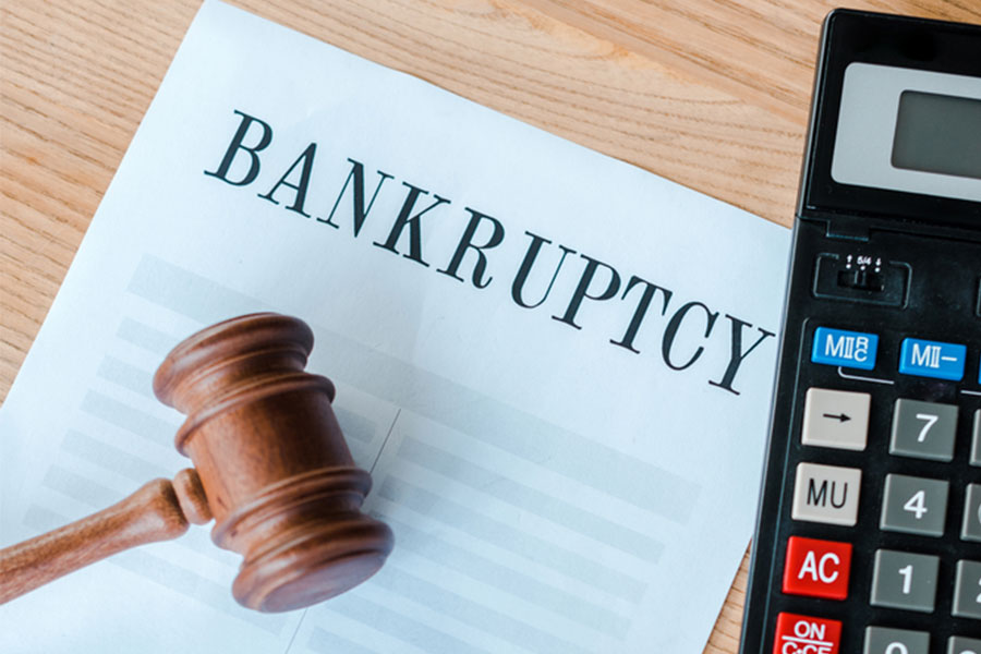 A gavel and legal documents symbolizing the intersection of bankruptcy and tort law in a courtroom setting.