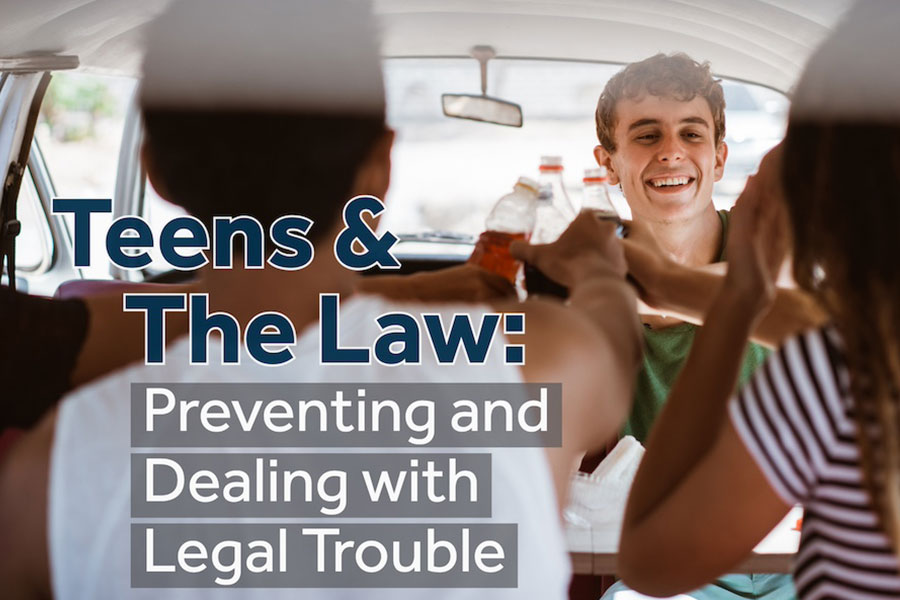 Four teens in a car smile while holding up open bottles
