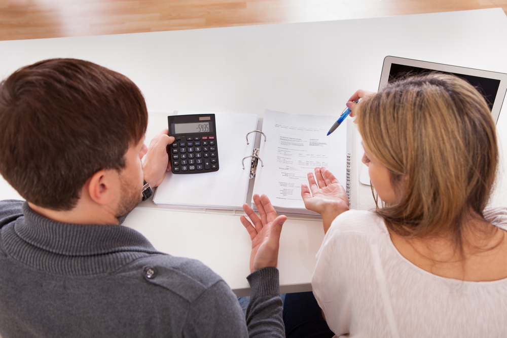 Husband and wife reviewing finances
